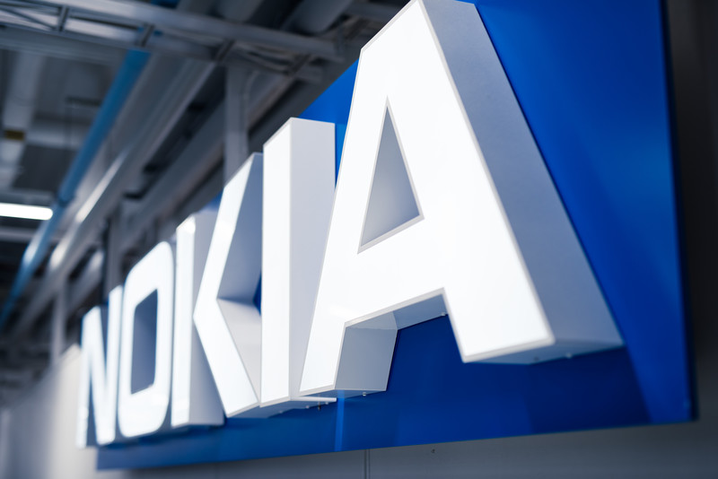 A large Nokia logo on a wall